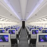 Rendering of an aircraft interior with Panasonic Avionics' Astrova screens installed