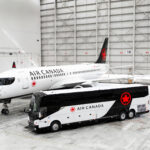 Landline bus in the Air Canada livery, plus an A220