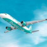 A320neo with teal and white flynas livery