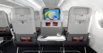 Showing off a tablet holder option for IFE, as well as a convenient in-seat USB power option, on the new Helix economy class seat (image via Collins Aerospace)