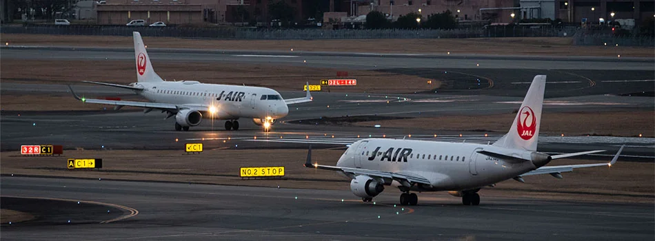 A pair of J-Air E90s, including one with the 2Ku radome installed