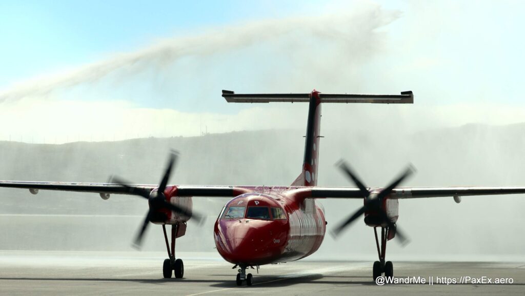 The inaugural Air Greenland flight from Nuuk to Iqaluit arrives with a traditional fire department salute