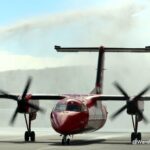 The inaugural Air Greenland flight from Nuuk to Iqaluit arrives with a traditional fire department salute