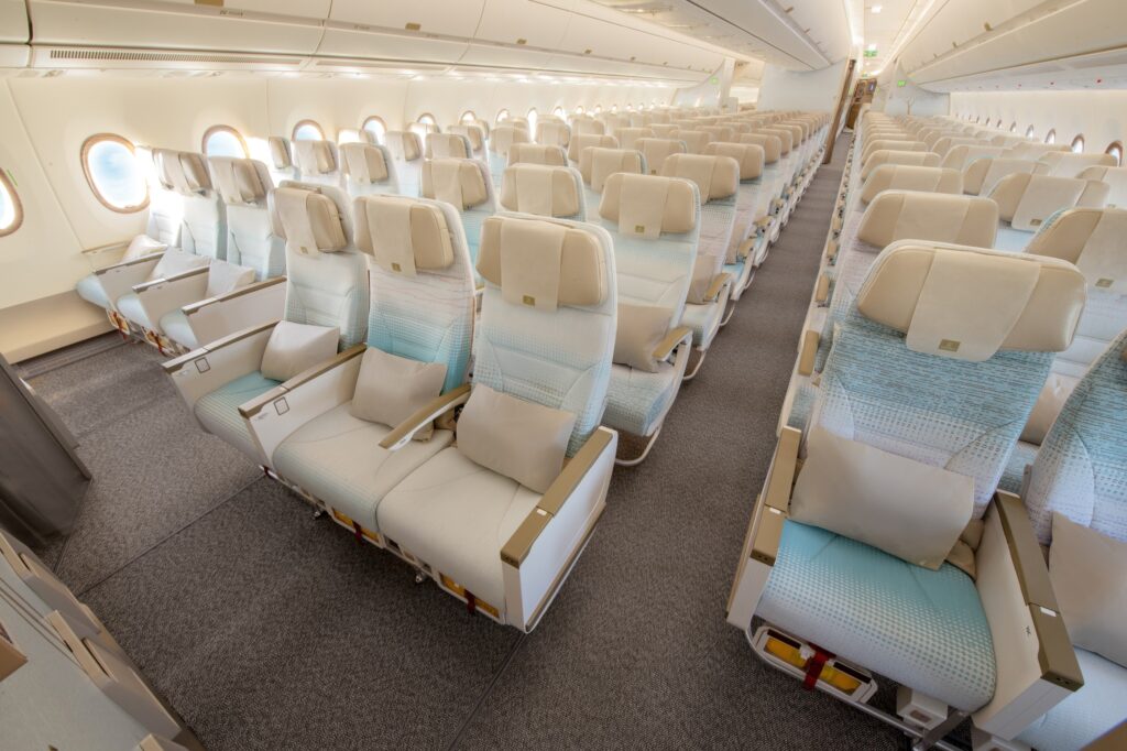 Economy class on Emirates new A350 features lighter colored seats and updated headrests for comfort
