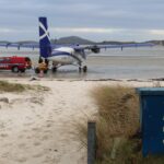 Loganair's Twin Otter parked on the beach in Barra, prepping for the return to Glasgow