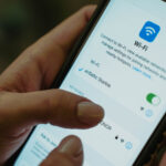 Selecting the airBaltic Starlink wifi network on an iPhone