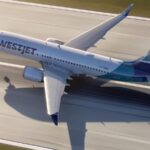 A WestJet 737 MAX 8 seen from above a runway