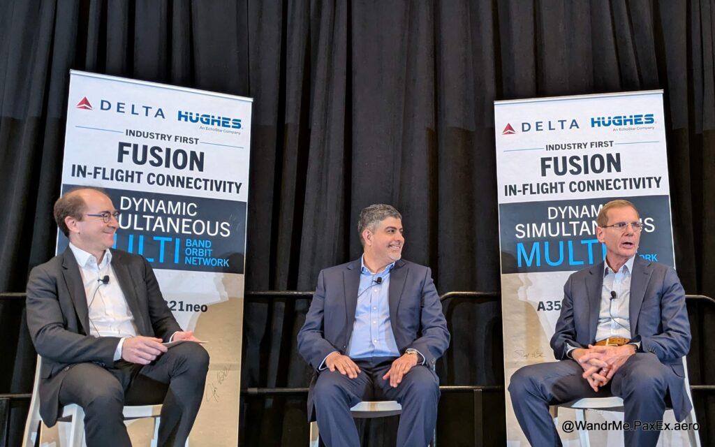 three guys sitting on a conference stage to chat.