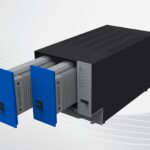 Black metal computer box with two grey and blue modules sliding out the front.