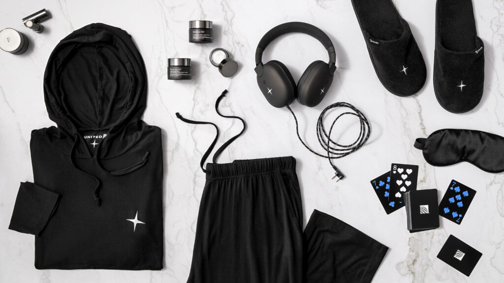 Some of the fancy new amenities for Polaris Studio passengers, including PJs and playing cards (Image via United)