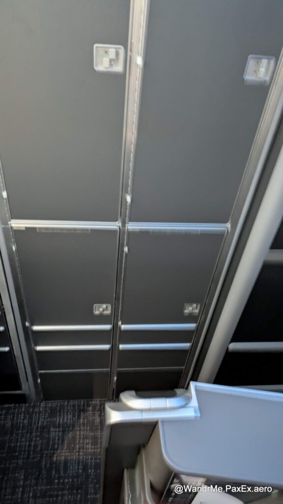 The passenger in 10D has this galley stowage as their seatmate across the aisle, not another passenger.