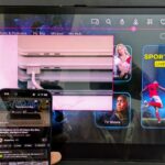 An iPhone being used to control the content on a Safran RAVE IFE screen