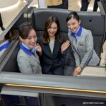 Not certified for flight, but three people in a business class seat is impressive