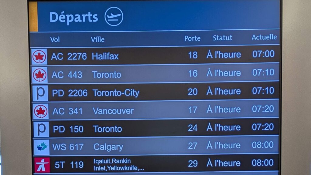 A Canadian airport departure board, showing more variety than is typical for the country's operations
