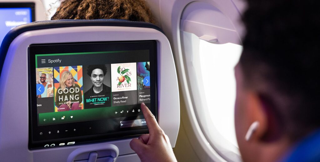 IFE screen showing Spotify content