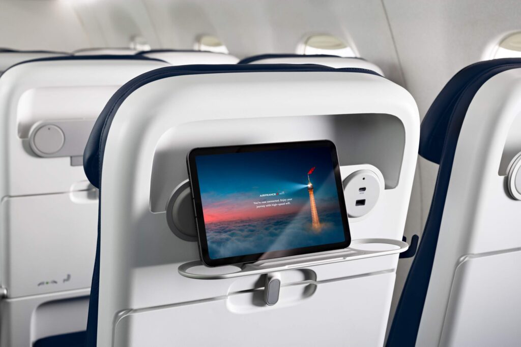The Expliseat TiSeat 2X includes USB power and a PED/cup holder (image via Air France)