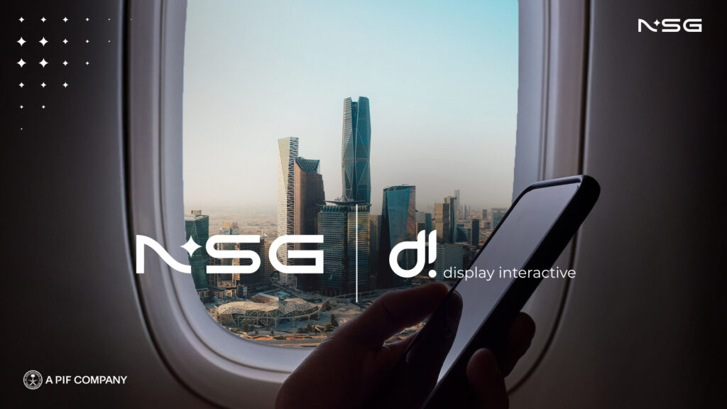Logos for NSG and DI overlaid on an airplane window overlooking a Saudi skline