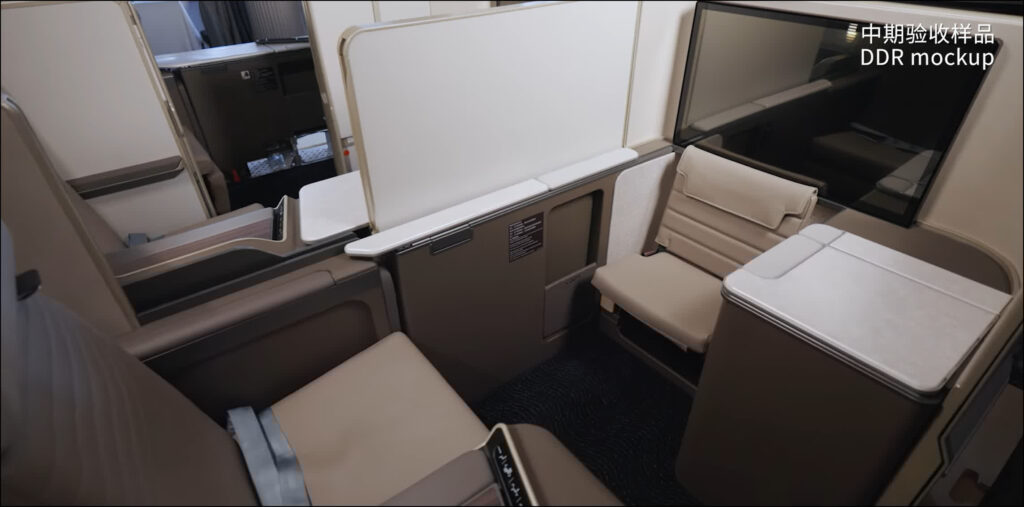 Giant screen and buddy dining seat in the ottoman area on the China Southern A350