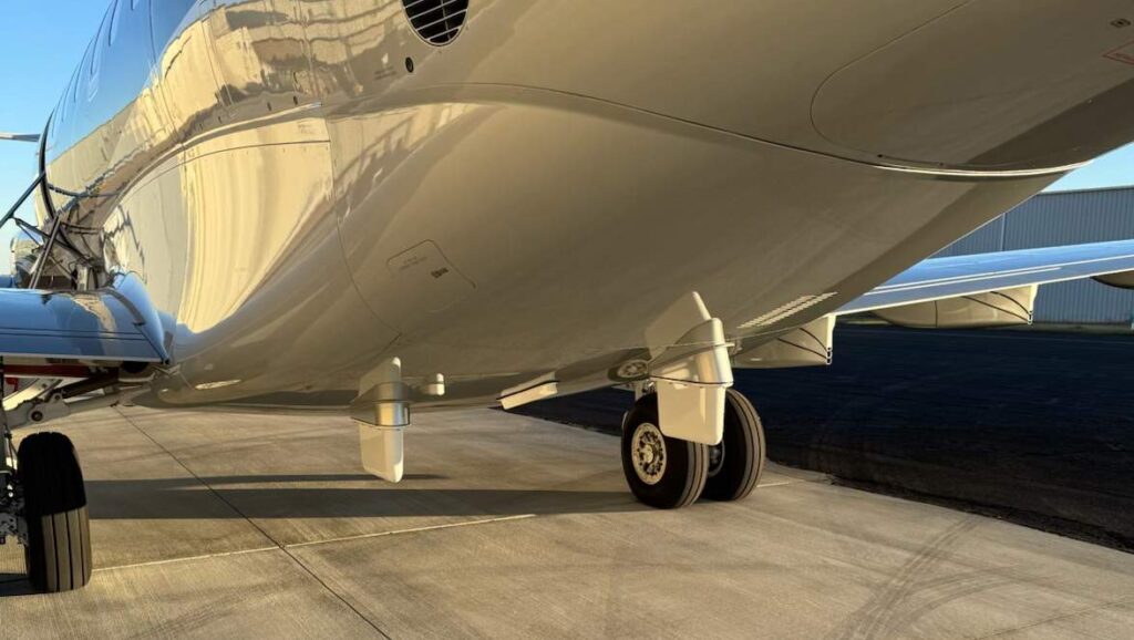 A few antennae on the bottom of a small business jet.