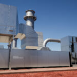 Silver boxes stacked together to be a portable power generation plant of sorts