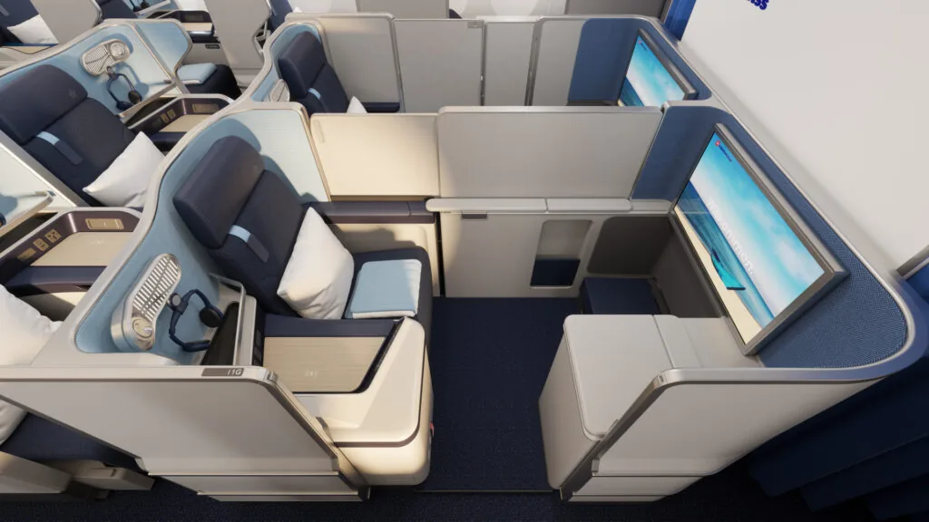 The front row of business class on Edelweiss's new A350 cabin features privacy doors and a bit of extra space, plus a larger IFE screen.