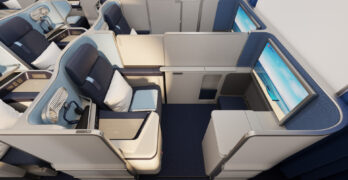 The front row of business class on Edelweiss's new A350 cabin features privacy doors and a bit of extra space, plus a larger IFE screen.