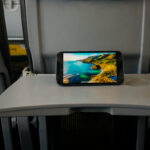 Watching streaming IFE on a small screen, set on a tray table on a Vueling plane