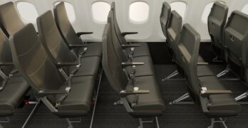 Rows of very slimline, dark grey, economy class seats in an easyJet cabin mockup.