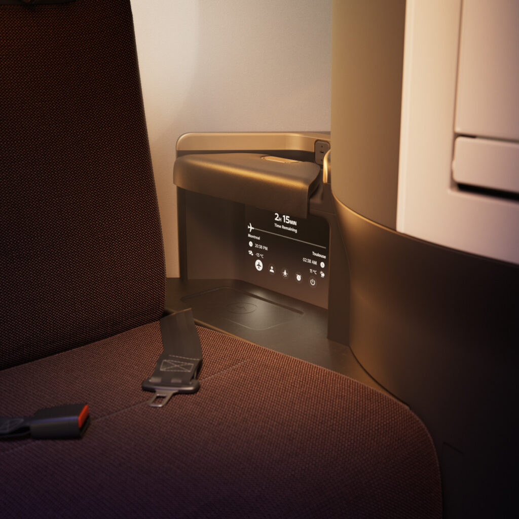 A mini IFE screen embedded in the seat wall to provide basic flight details while in bed mode