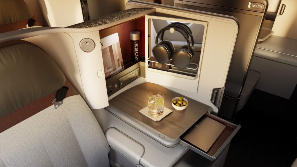 Side table with various storage options on the Unum Two business class seat