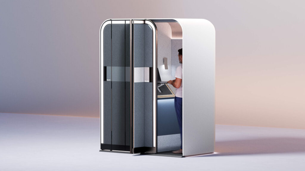 A standing desk in the Boeing e-Lounge makes video calls or just a quick bit of work more comfortable for the passenger, and the noise-dampening walls keep things quiet for everyone else on board (image via Boeing)