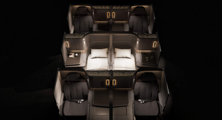 overhead of three rows of Unum Two business class seats in a very dark color scheme