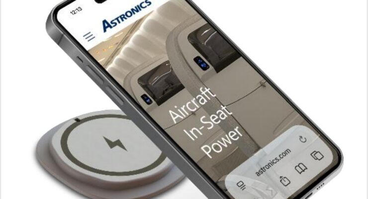 mobile phone hovering over the new Astronics emPower Qi2 wireless charging interface.