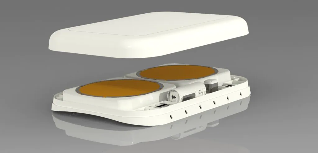 Rendering of a small aircraft antenna consisting of two round apertures and a very low profile radome on top.