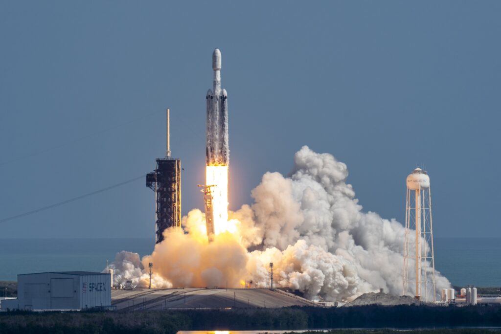 Launch of a Falcon Heavy rocket, with three boosters all firing, as it clears the tower in Florida.