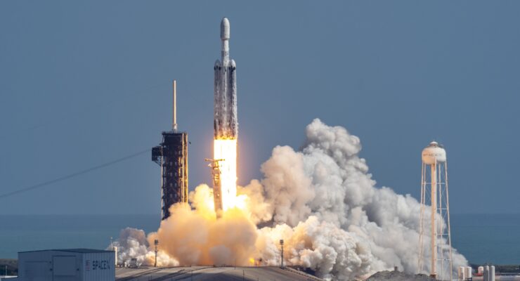 Launch of a Falcon Heavy rocket, with three boosters all firing, as it clears the tower in Florida.