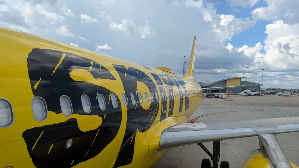 Yellow plane with spirit in black on the side.