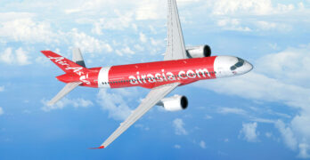 rendering of the A220 in AirAsia's red livery, flying in blue skies with a few clouds
