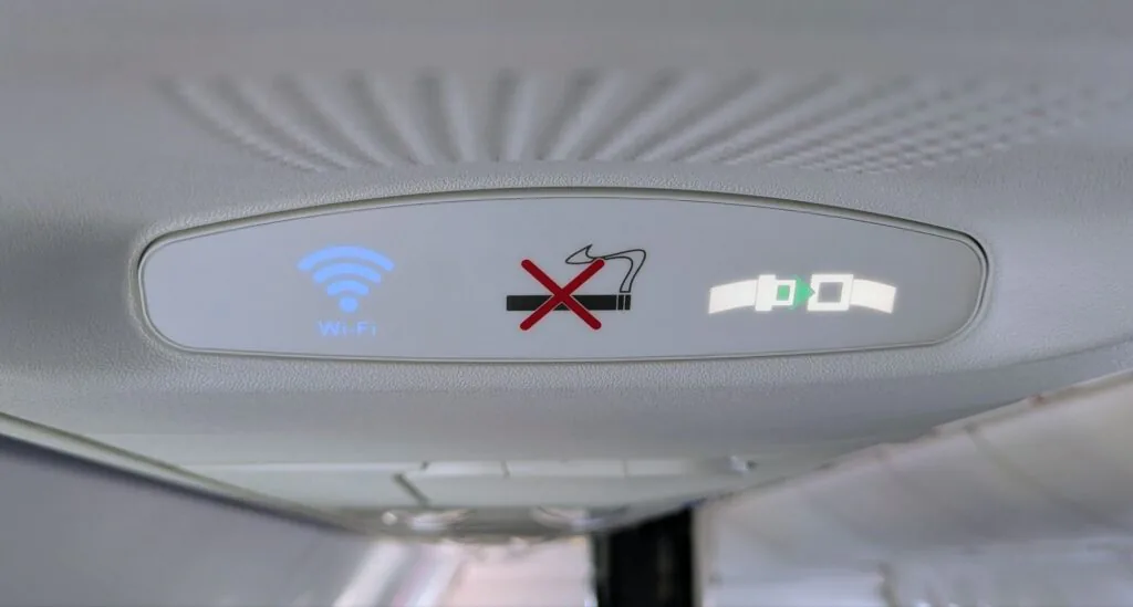 Airplane PSU display with wifi, seatbelt, and no smoking indicators