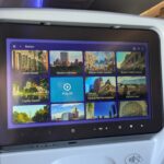 Grid of destination content on an airplane seatback IFE system