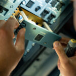 A technician installs the Starlink control switch in the flight deck of a Lufthansa A320neo in preparation for service launch (image via Lufthansa Group)