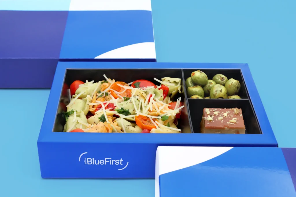 BlueFirst passengers will be served a "FirstFare" cold snack on board flights longer than 899 miles (image via JetBlue)