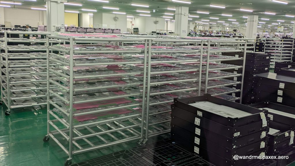 Racks filled with OLED screens of various sizes, awaiting their integration into the new Astrova monitors at the Panasonic Avionics factory in Osaka