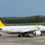 Royal Brunei A320 with a yellow tail and white body